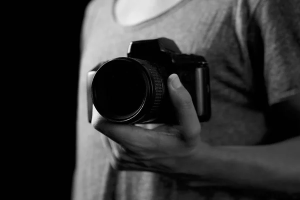 Young man with a reflex camera — Stock Photo, Image