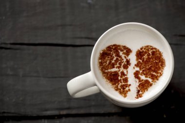 cup of cappuccino with a broken heart clipart