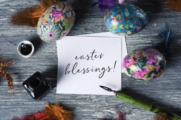 Homemade decorated eggs and text easter blessings — Stock Photo, Image
