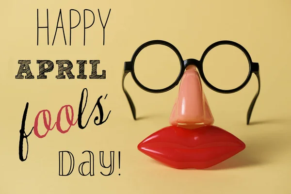 Novelty glasses and text happy april fools day — Stock Photo, Image