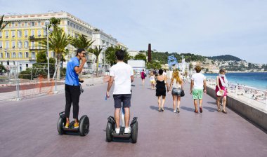 people at Promenade des Anglais in Nice, France clipart