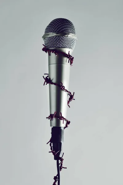 Barbed wire around a microphone — Stock Photo, Image