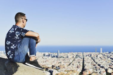 young man with Barcelona, Spain, below him clipart