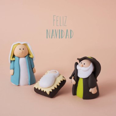 Kutsal aile ve mesaj İspanyolcada mutlu noeller.