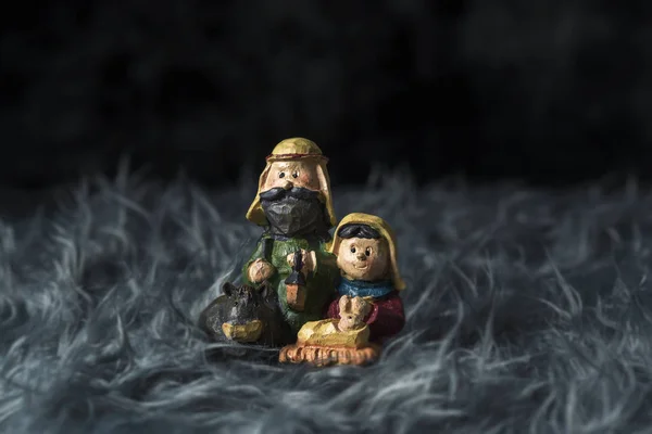 The holy family on a gray artificial fur — Stockfoto