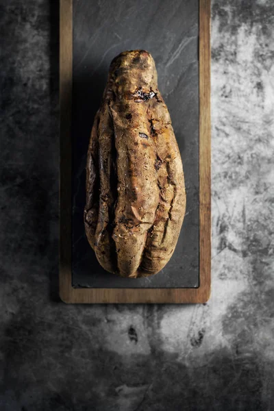 Roasted sweet potato on a slate tray — Stock Photo, Image