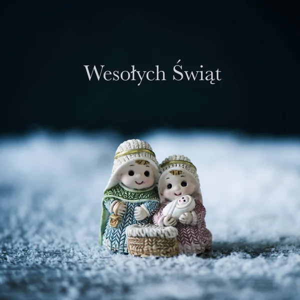 Nativity scene and text merry christmas in polish — Stock Photo, Image