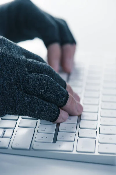 man wearing compression gloves