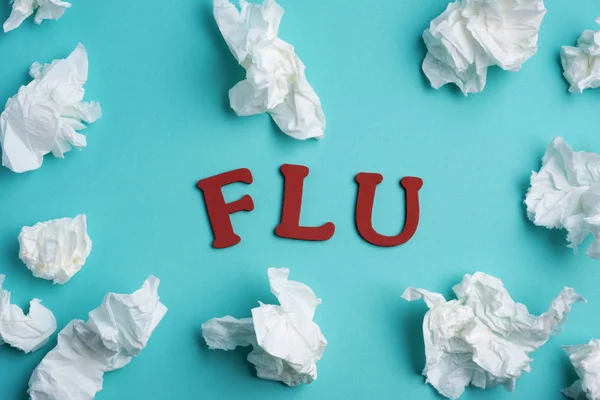 Word flu and a pile of used tissue — Stock Photo, Image