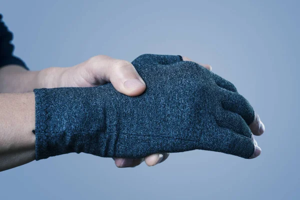 Man wearing a compression glove — Stock Photo, Image