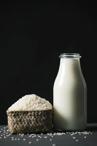 Rice and bottle of rice milk — Stockfoto