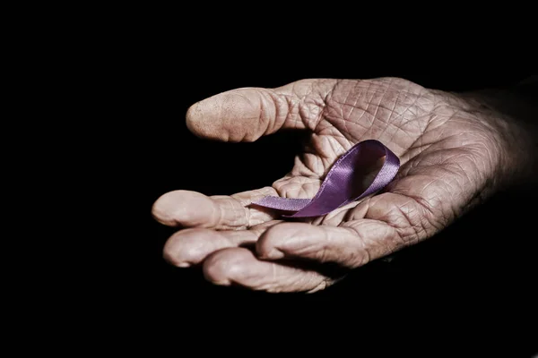 Closeup Senior Caucasian Woman Purple Ribbon Her Hand Black Background — Stock Photo, Image