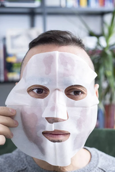 Closeup Handsome Caucasian Man Applying Bio Cellulose Sheet Mask His — Stock Photo, Image