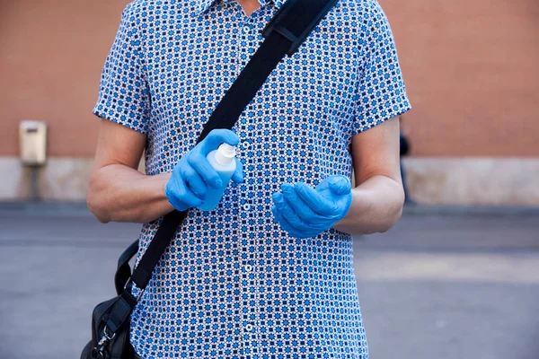 Closeup Caucasian Man Street Wearing Blue Latex Gloves Disinfecting His — Stock Photo, Image