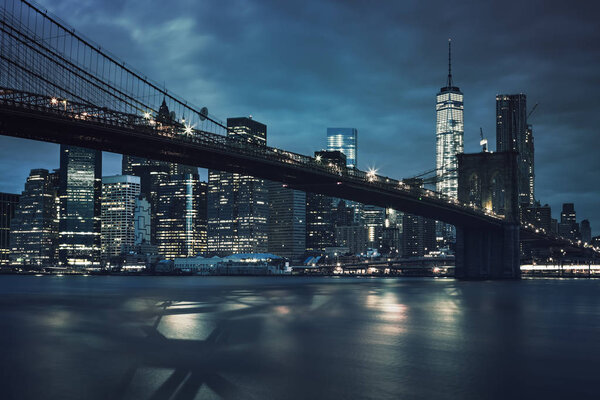 View of Brooklyn Bridge by night, NYC.