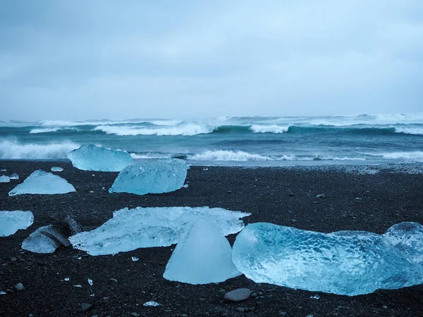 Iceberg on Iceland\'s black sand beach.