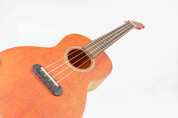 Beyaz arka plan üzerinde izole kahverengi ukulele, Hawai gitar,. — Stok fotoğraf