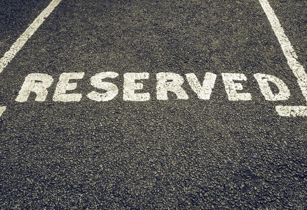 Vintage looking Reserved parking sign — Stock Photo, Image