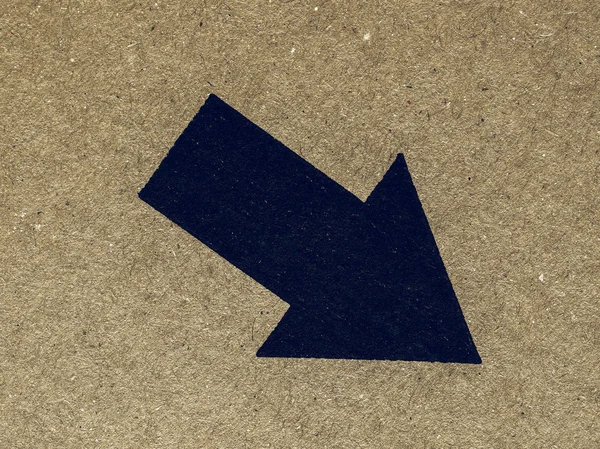 Vintage looking Black arrow on cardboard — Stock Photo, Image