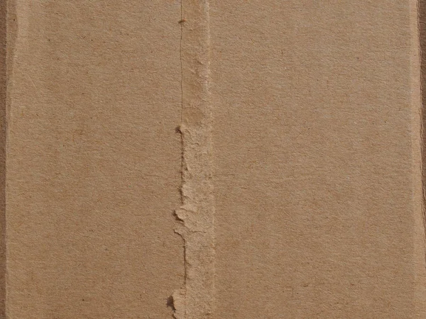 Коричневый гофрированный картонный фон — стоковое фото