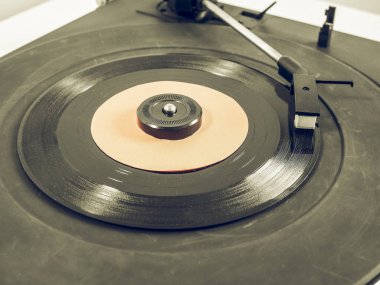 Vintage looking Vinyl record on turntable clipart