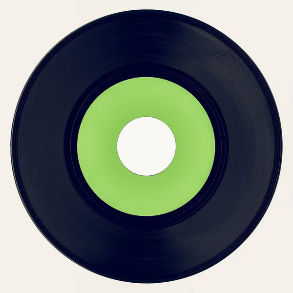 Vintage procurando disco de vinil com rótulo verde — Fotografia de Stock