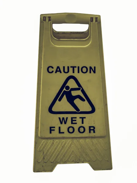 Vintage looking Caution wet floor — Stock Photo, Image