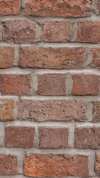 Rode bakstenen muur achtergrond - verticale — Stockfoto