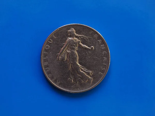 Монета в 1 франк, Франция над синим — стоковое фото
