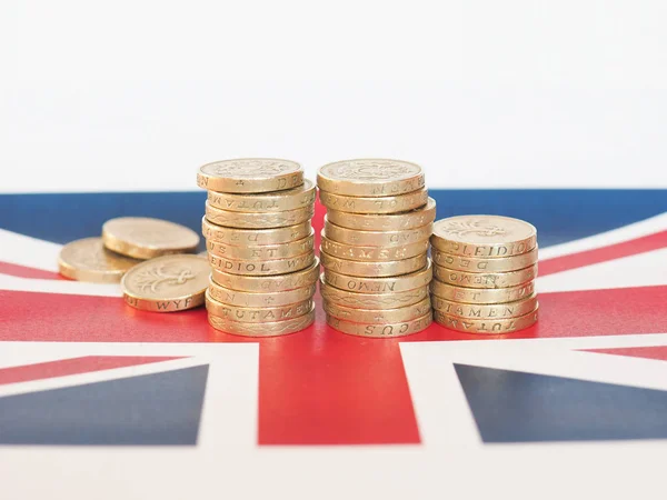 Funt monety, Wielka Brytania nad flagą — Zdjęcie stockowe