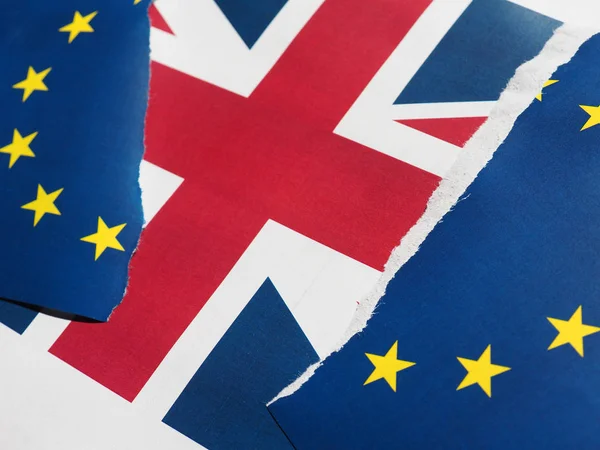 Torn EU flag over UK flag — Stock Photo, Image