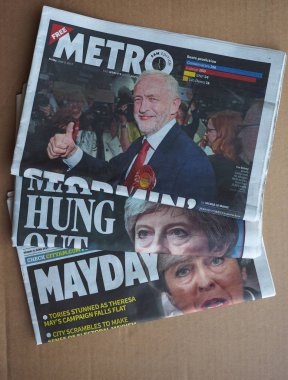 Newspapers showing Theresa May and Jeremy Corbyn clipart