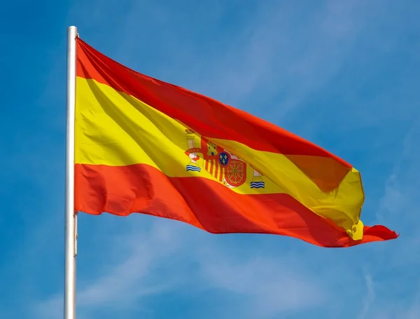 Spanish Flag of Spain over blue sky — Stock Photo, Image