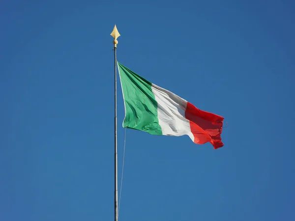 Italian Flag of Italy over blue sky — Stock Photo, Image