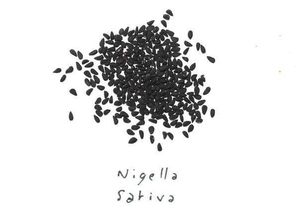 Black Cumin (Nigella Sativa) seeds over white — Stock Photo, Image
