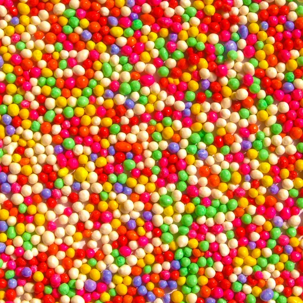 Färgat socker bakgrund — Stockfoto