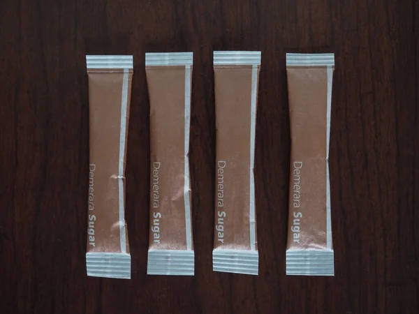Demerara brown sugar bags — Stock Photo, Image