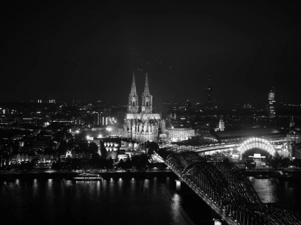Aerial night view of St Peter Cathedral and Hohenzollern Bridge, — Stock Photo, Image