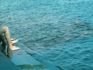 water flow splash and woman legs