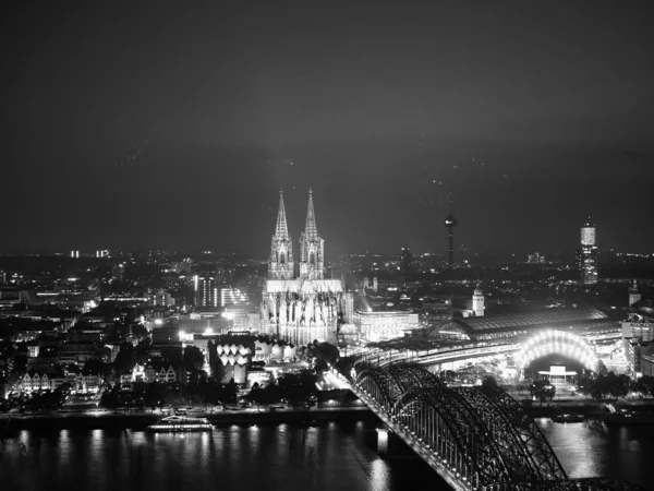 Aerial night view of St Peter Cathedral and Hohenzollern Bridge, — Stock Photo, Image