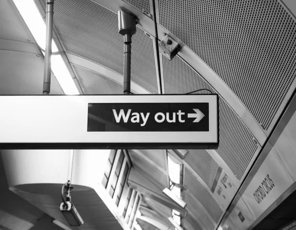 Oxford Circus tube station way out sign in London, black and whi — Stock Photo, Image