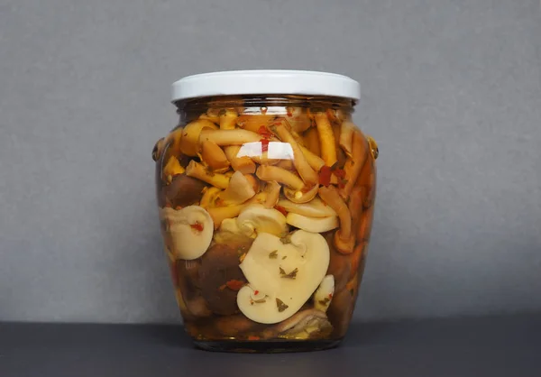 Mixed champignons and porcini mushrooms in jar — 스톡 사진