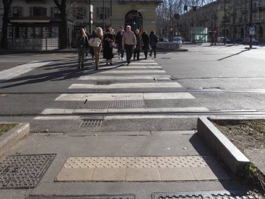 TURIN, ITALY - CIRCA FEBRUARY 2020: People walking in the city centre