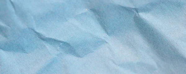 wide blue crinkled paper texture useful as a background