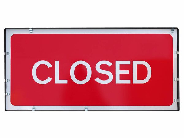 Closed sign a in shop window isolated over white background