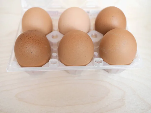 half dozen (six) eggs in carton box