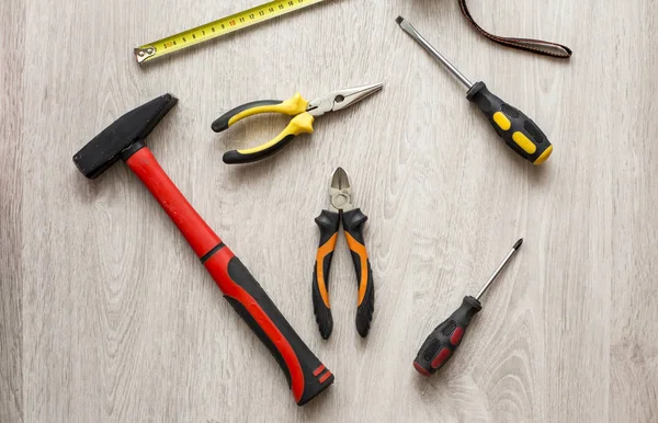 Desk of a carpenter with different tools. Studio shot on a woode — Stock Photo, Image