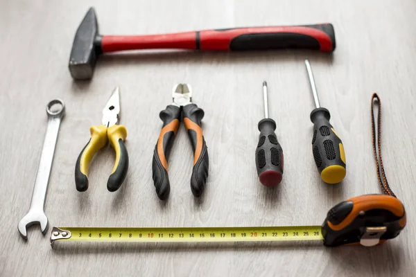 Grunge old home tools wrench on wood floor background — Stock Photo, Image