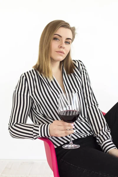 Pretty woman drinking wine at home — Stock Photo, Image