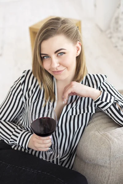 Happy woman with a big glass of red wine. — Stock Photo, Image